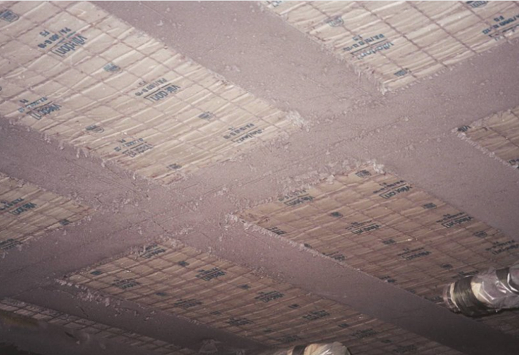 Ceiling with thermal insulation panels installed between beams.